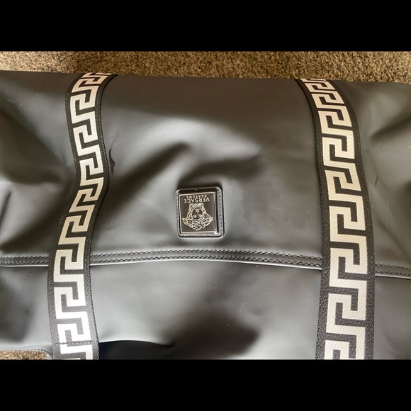 I am selling a Versace duffel bag. It is silver and black. - Picture 7 of 7